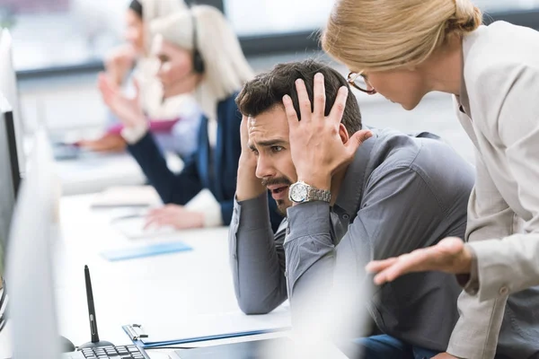 Businesswoman pressing on colleague — Stock Photo