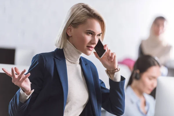 Businesswoman talking on smartphone — Stock Photo