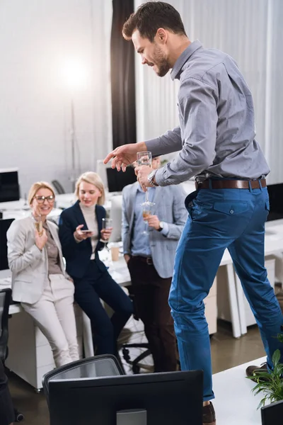 Business colleagues with glasses of champagne — Stock Photo