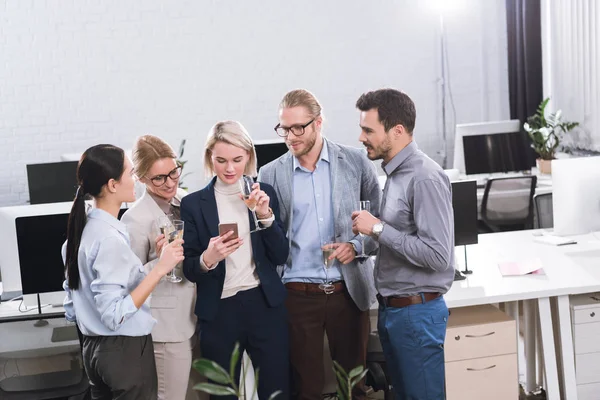 Business team drinking champagne — Stock Photo