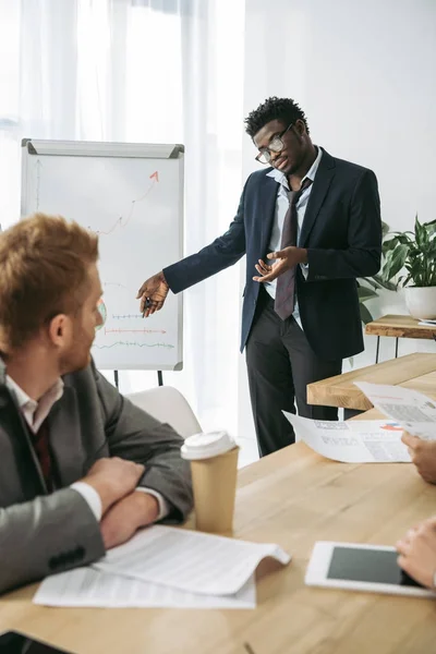 Overworked zombie like businesspeople making presentation at office — Stock Photo