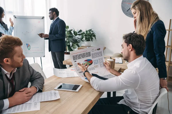 Exhausted businesspeople having conversation at office — Stock Photo