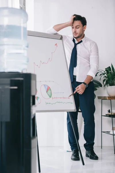 Overworked sleepy businessman making presentation at office — Stock Photo