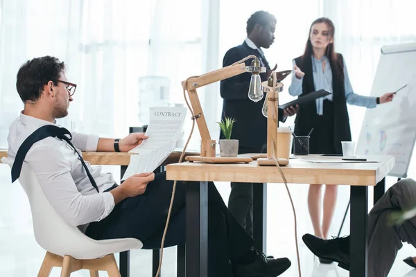 Group of tired managers having conversation at office — Stock Photo