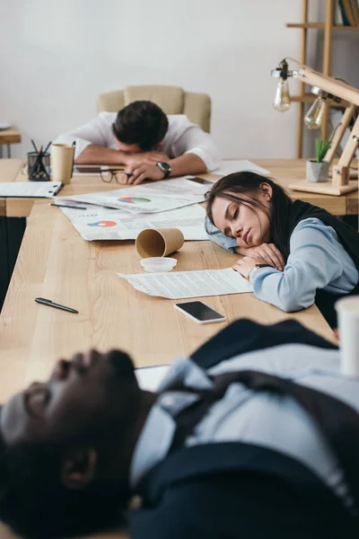 Group of businesspeople sleeping in conference hall at office — Stock Photo