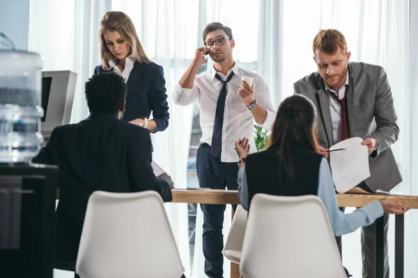 Group of business partners having conversation at office — Stock Photo