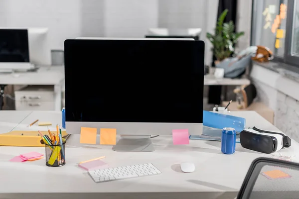 Modern computer with blank screen at workplace in office — Stock Photo