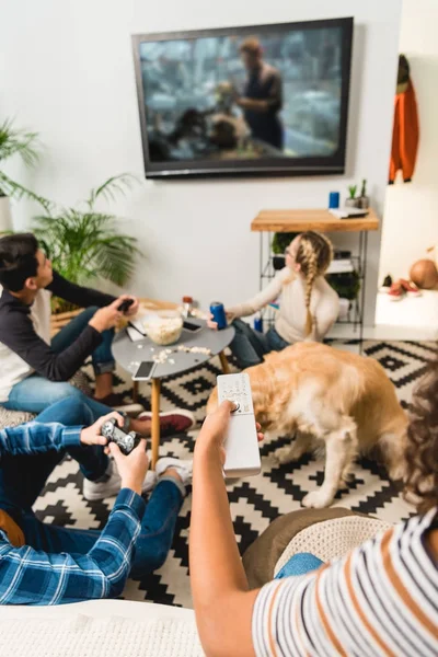 Cropped image of group of multiethnic teenagers playing video game — Stock Photo