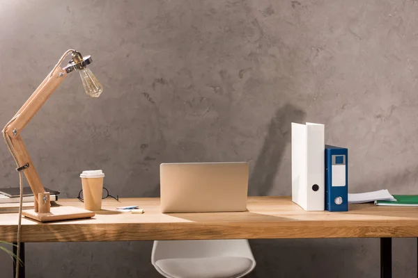 Laptop on working table in business office — Stock Photo