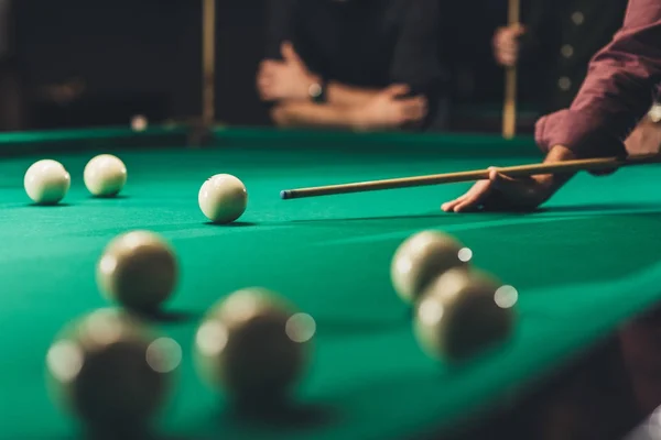 Side view of cropped man playing in russian pool at bar — Stock Photo