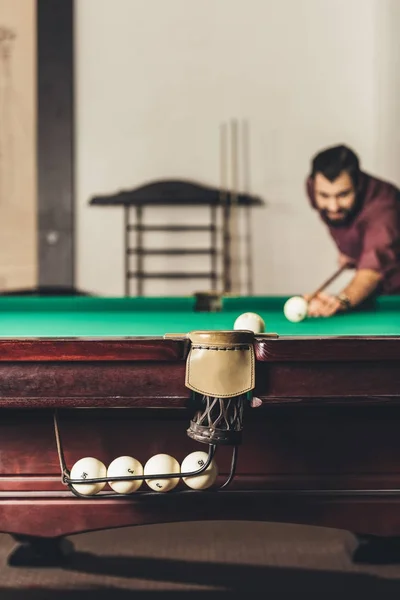 Handsome successful man playing in russian pool — Stock Photo