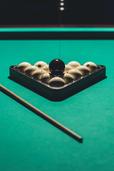 Gambling table with russian billiard set and cue — Stock Photo