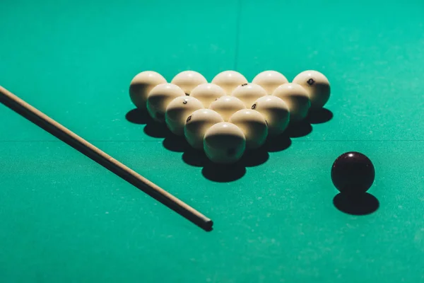 Gambling table with russian billiard set and cue — Stock Photo