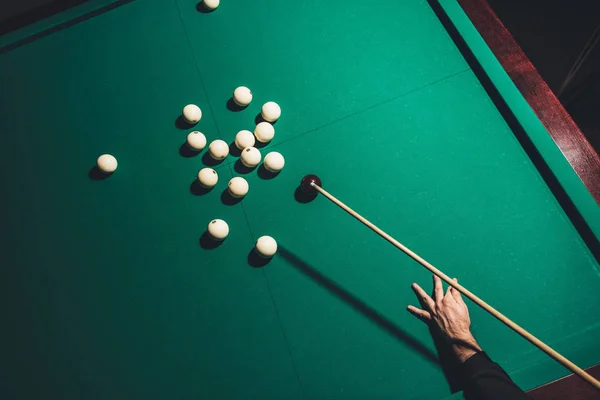 Cropped image of male playing in russian pool — Stock Photo