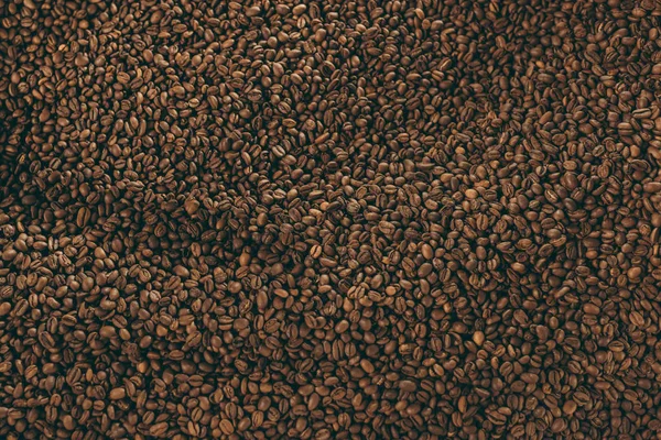 Full frame of heap of roasted coffee beans — Stock Photo