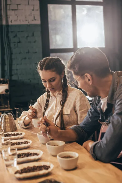 Coffee shop workers checking coffee quality during coffee food function — Stock Photo