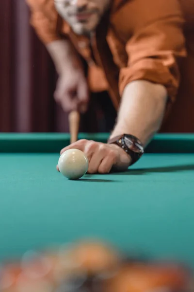 Cropped image of man playing in pool — Stock Photo