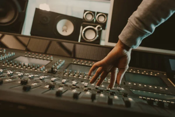 Cropped shot of sound producer setting graphic equalizer at studio — Stock Photo