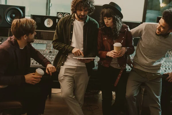 Music band having conversation at sound recording studio — Stock Photo