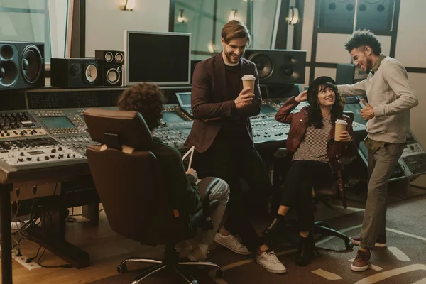 Sound producers spending time at recording studio — Stock Photo