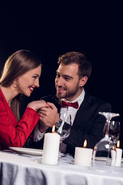 Beautiful smiling couple spending time on romantic date in restaurant — Stock Photo