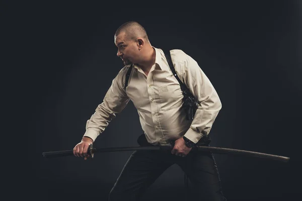 Yakuza member taking out his katana sword — Stock Photo