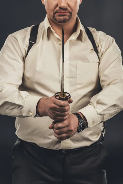 Cropped shot of yakuza member holding japanese tanto knife in hands — Stock Photo