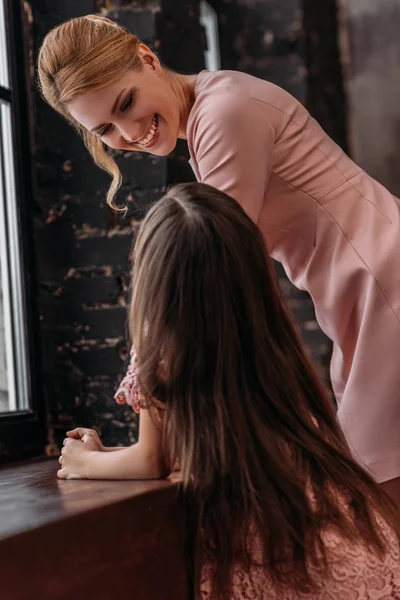 Mother and daughter spending time together at home — Stock Photo