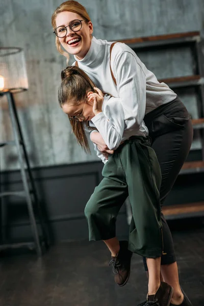 Young mother and daughter playing in loft apartments — Stock Photo