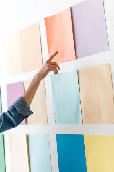 Cropped view of magazine editor pointing at color palette — Stock Photo