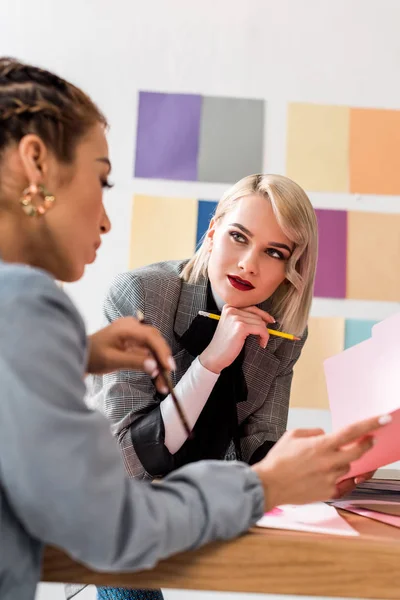 Multiethnic magazine editors working in modern office — Stock Photo