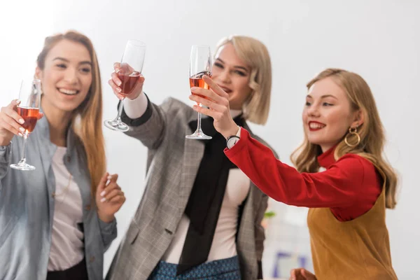 Happy successful businesswomen celebrating with champagne — Stock Photo