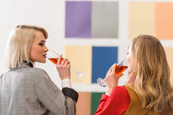 Successful magazine editors celebrating and drinking champagne in modern office — Stock Photo