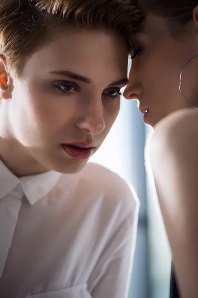 Close-up shot of young cuddling lesbian couple — Stock Photo