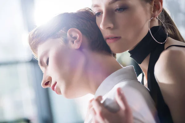 Close-up shot of sensual lesbian couple embracing — Stock Photo