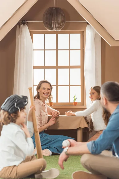 Young family spending time together at cardboard house — Stock Photo