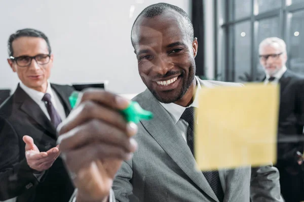 Selective focus of multicultural businessmen having meeting in office — Stock Photo