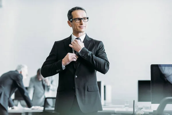 Selective focus of businessman in eyeglasses in office — Stock Photo