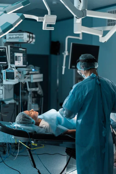 Surgeon operating patient in operating room — Stock Photo