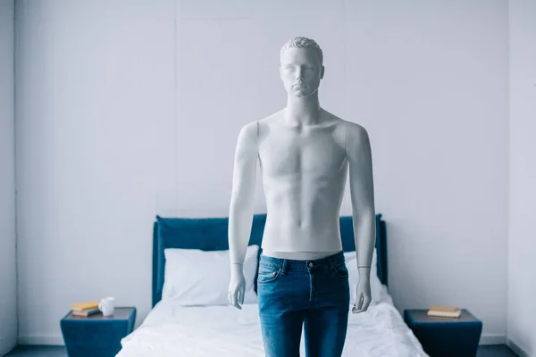 Close up view of layman doll in jeans in bedroom — Stock Photo