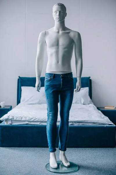 Selective focus of layman doll in jeans in bedroom — Stock Photo