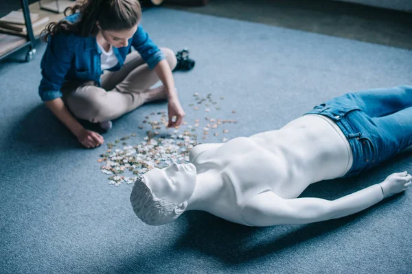 Woman playing with puzzles with manikin near by, perfect relationship dream concept — Stock Photo