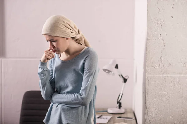 Portrait of upset sick young woman in kerchief, cancer concept — Stock Photo