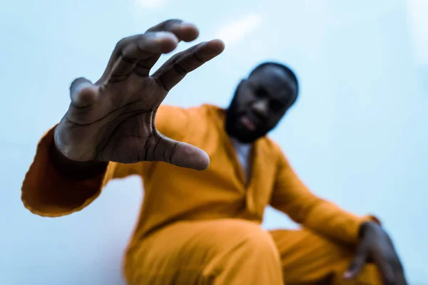 African american prisoner with hand on foreground — Stock Photo