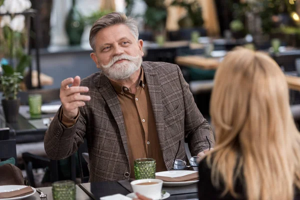 Selective focus of senior man and woman in cafe — Stock Photo