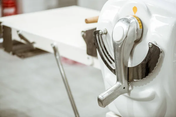 Close-up shot of industrial dough roller handle — Stock Photo