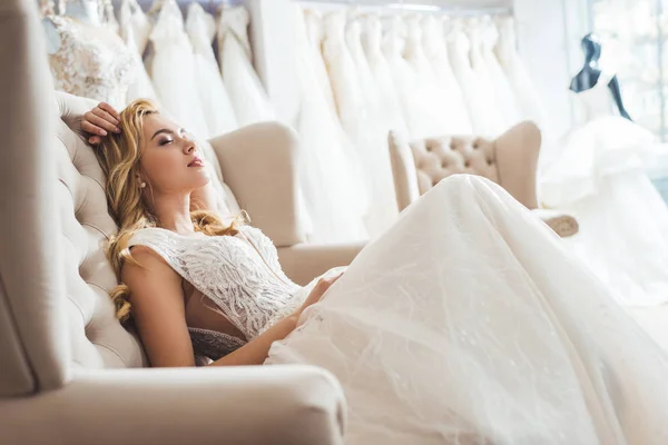 Attractive bride in tulle dress in wedding fashion shop — Stock Photo