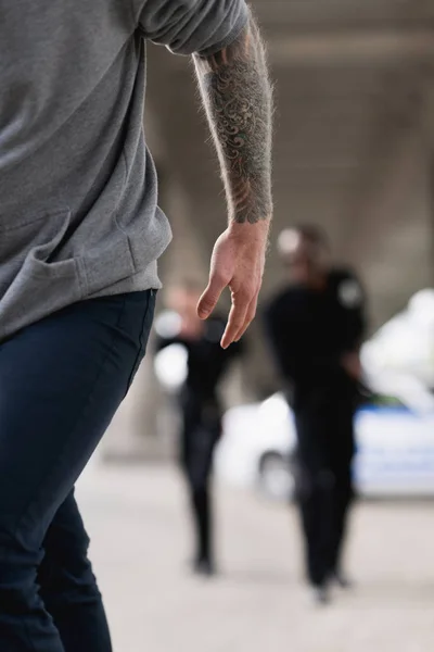 Cropped shot of thief running from police — Stock Photo