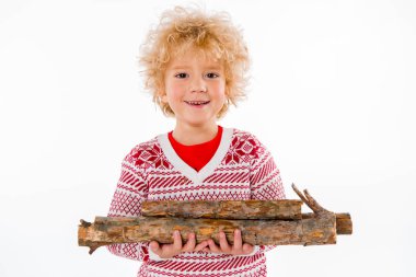 child standing with firewood in hands clipart
