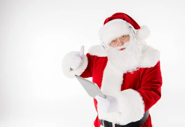 Babbo Natale ascoltare musica con le cuffie — Foto Stock